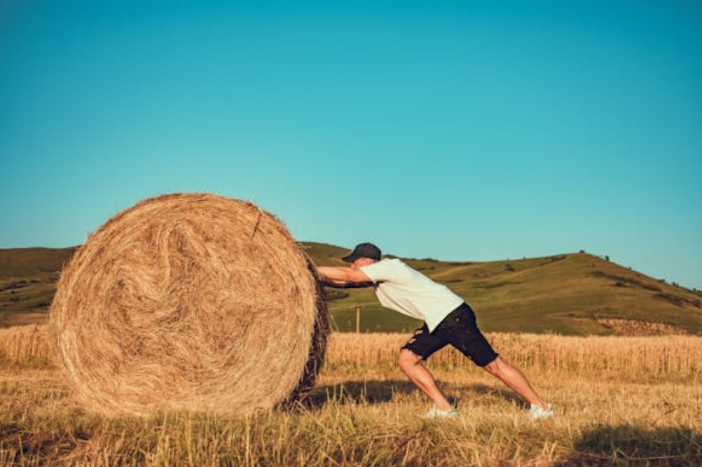 Man pushing barrel, habit loops, habit, exercise
